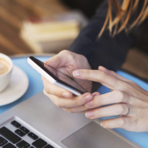 mobile internet, wifi connection on smartphone in cafe